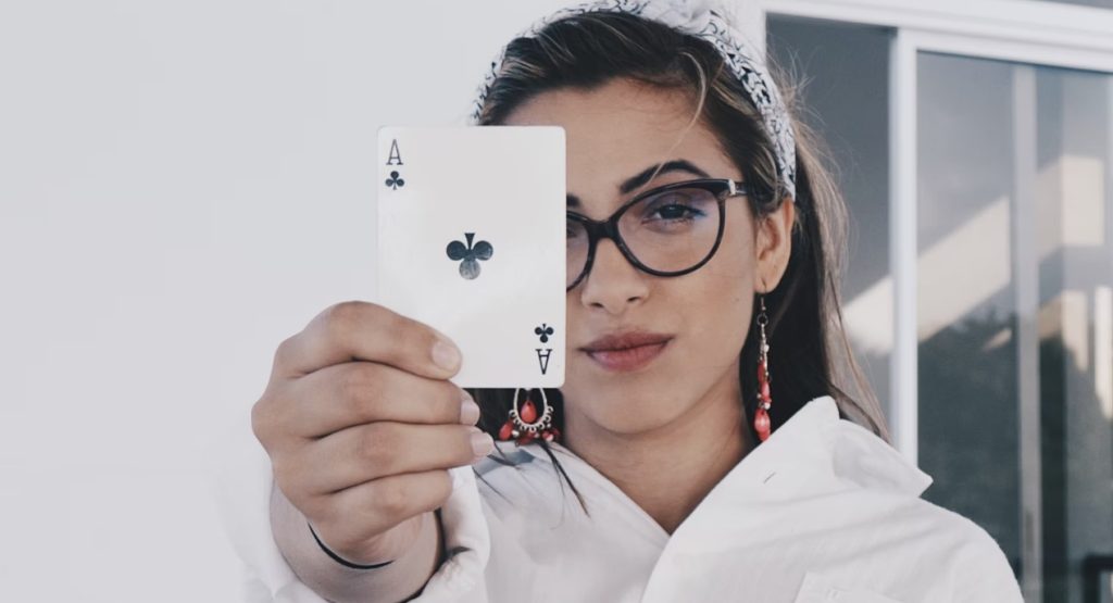 girl showing trick on How to Win at Baccarat using Flat Betting